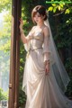 A woman in a wedding dress leaning against a window.